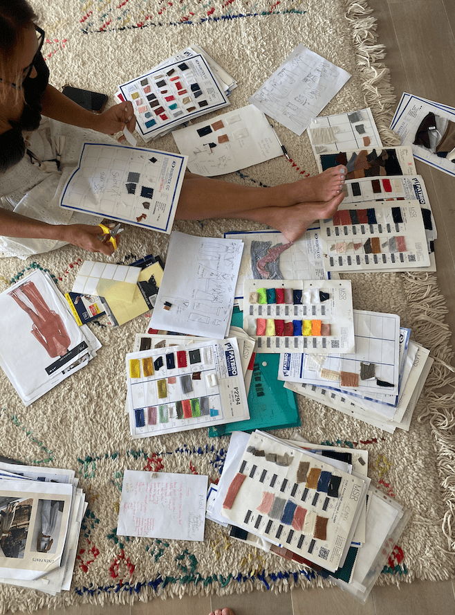 Maxine Benatar choosing fabrics and colours in her Cape Town studio
